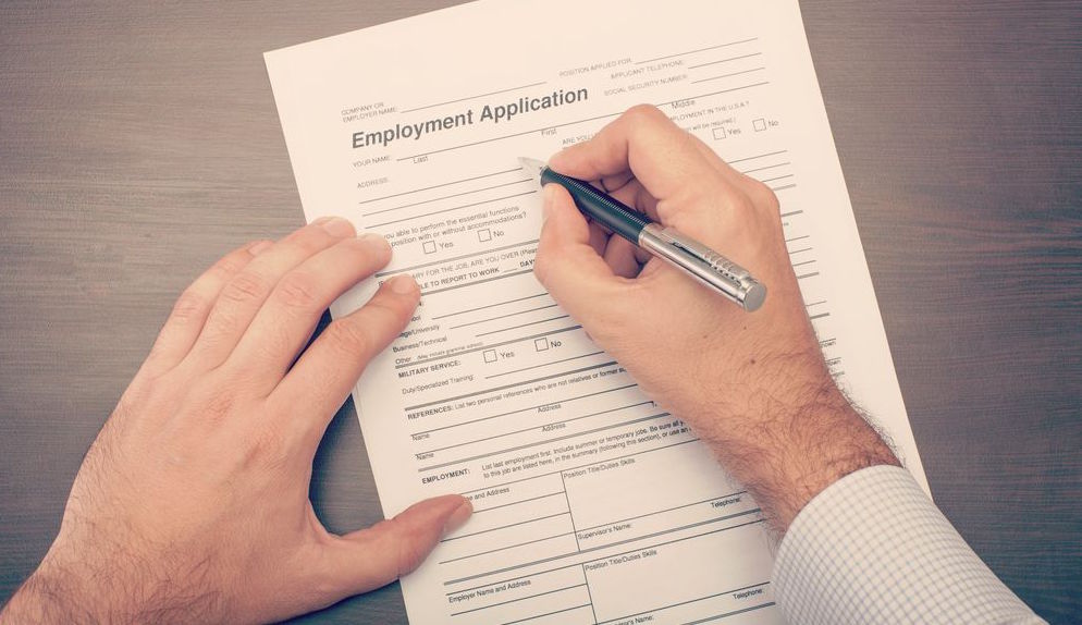 Filling application. Человек отвечает на заявки стоковое изображение. Application form for job. Filling in an application form. Filling in application.